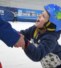 A young boy taking part in snowsports at a BBS Have a Go Day.