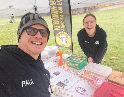 Paul takes a selfie with Alice while selling cakes at Parkrun to raise money for British Blind Sport. 