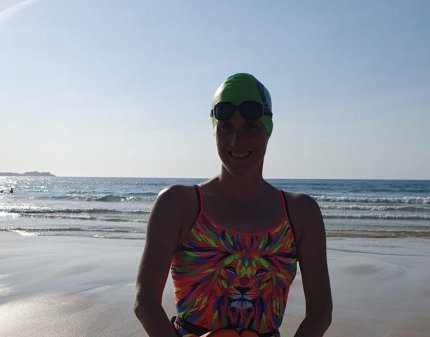 Melanie Barratt on the beach after swimming in the sea in Dover.